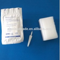 Disposable surgical scrub brush with nail cleaner